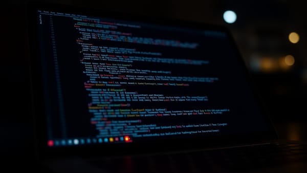 A laptop screen showing code with a visible warning indicator, representing AI-generated code security risks